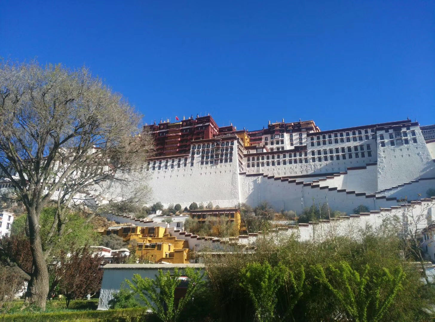 The Potala Palace in Lhasa beneath a clear blue sky